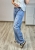 jeansy damskie luźny fason wide leg jasne z czerwonym haftem wisienki casual look modne jeansy damskie jasny denim szeroka nogawka haftowane wisienki styl miejski