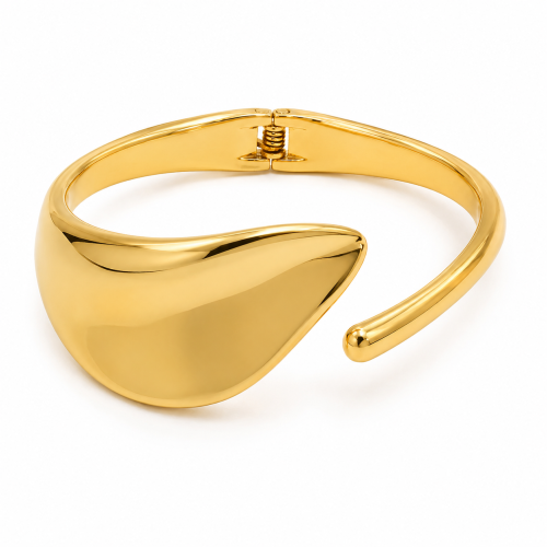 Elegancka złota bransoleta cuff o nowoczesnym rzeźbiarskim kształcie