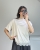 Elegancka bluzka beżowa z koronkowym dołem Bluzka oversize z ozdobną koronką