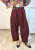 Eleganckie spodnie damskie o kroju barrel w kolorze bordo